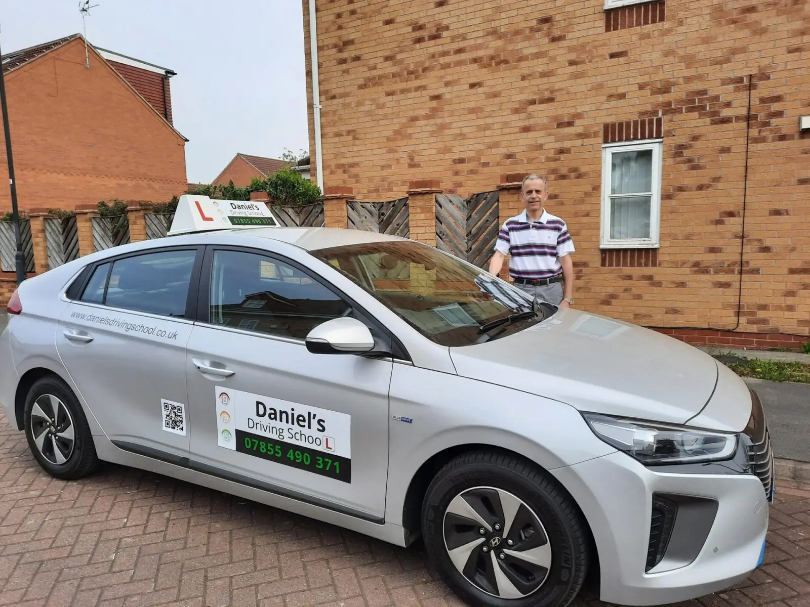 Daniel with his dual-controlled Hyundai Ioniq tuition car, Daniel's Driving School York